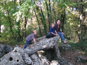 Jessica and her boys climbing on the Dolmen (ancient, sacred rocks put together by the ancient people of Europe.  The most prominent and known Dolmen is Stonehenge) near their castle in France.